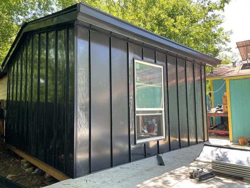 Black standing seam metal wall panels for Roof Inspection in South Daytona