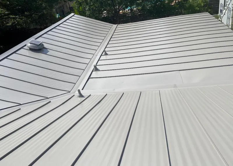 Solar attic fan installed on a metal roof for Roof Ventilation in South Daytona